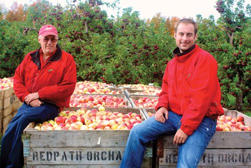 Father and son (second and third generation apple growers) David, left, and Chris Alpers operate Redpath Orchards, based in East Leland, Mich.