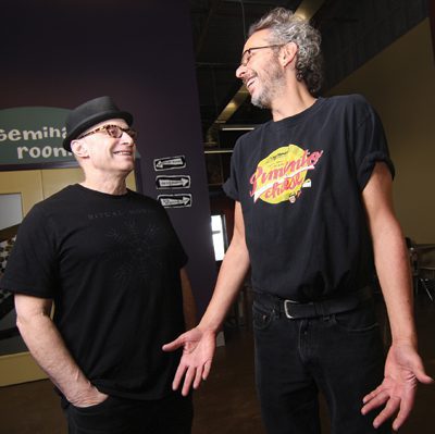 Friends as much as partners, Paul Saginaw, left, and Ari Weinzweig share a moment at Zingerman’s in historic downtown Ann Arbor. Photo by Rosh Sillars