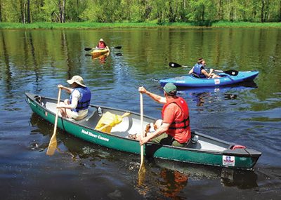 GR Paddling, whose motto is "Carpé Aqua,” takes tourists kayaking and canoeing on the Grand River. John Neumann looks forward to new respect for the river in Grand Rapids.