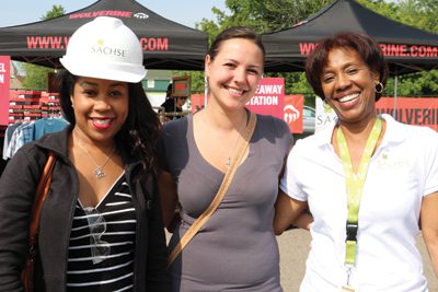 Sachse Construction employees, from left, Camille Martin, Wendi Carrio, and Jaye Davis-Brown attend the "Project Bootstrap" event hosted by Wolverine at the Detroit company’s Michigan Humane Society project.