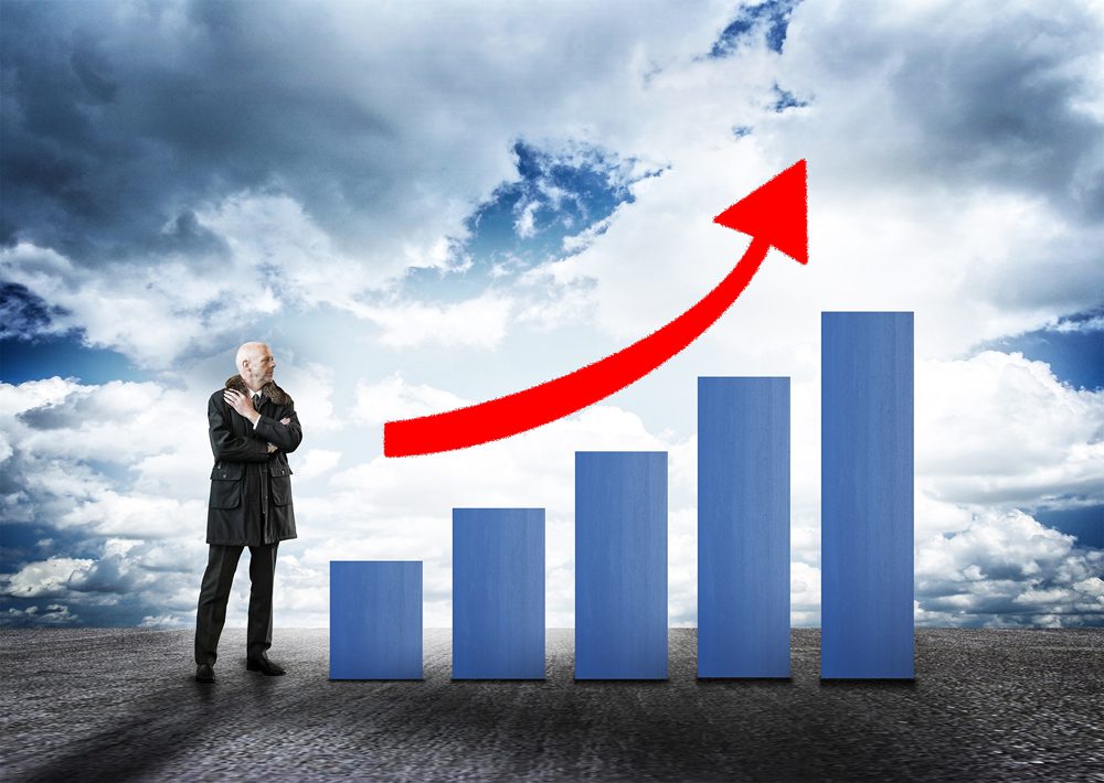 Businessman and Bar Chart with Arrow - Money Growth Concept