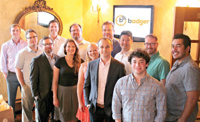 Troy-based Badger has close corporate ties to TPS Logistics, where Badger CEO Parker Stallard, center back row, also oversees sales and business development.