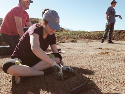 Megan King and Nathaniel Downs from 3Degrees dig in for a community planting project. Their 3DGives! program operates year-round to keep community connections on track.