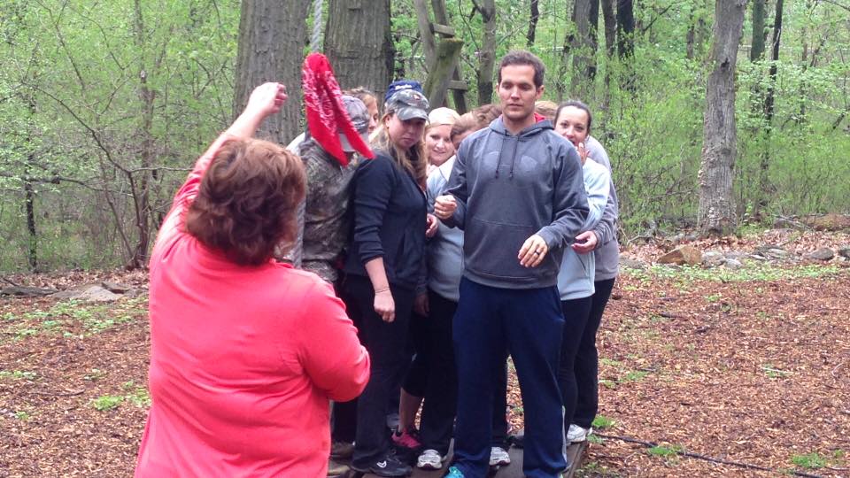 Conquering the low-ropes course at the YMCA Camp. Physical activities bring us together because while everyone has a role here in the office, WHO we are as individuals is just as important as WHAT we do in our respective roles here at Good Life.