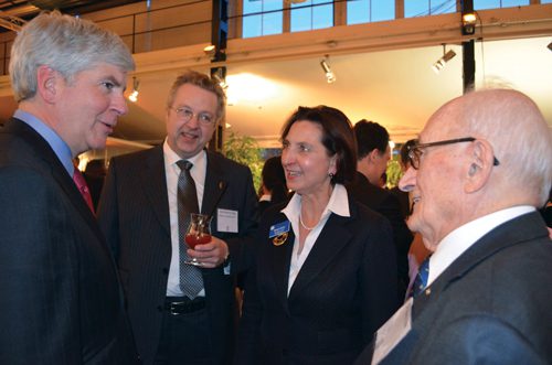 Gov. Rick Snyder, left, meets with Klohs at an executive reception in Germany during a recent European trade mission.