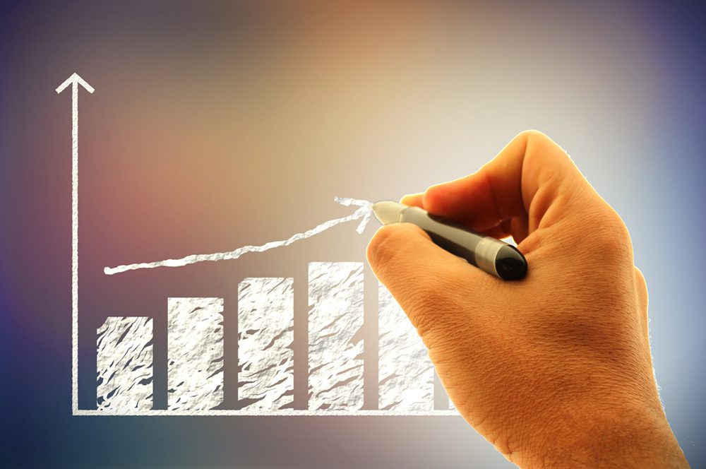 Businessman drawing a financial graph (histogram)