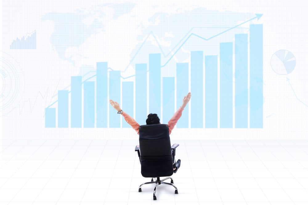 Business CEO and profit graph on blue world map