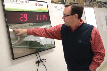 Doug Clemens, a fourth generation family owner and CEO of Clemens Food Group, points out areas of the sprawling facility being constructed in Coldwater, Mich. The numbers show the days left before construction is complete.