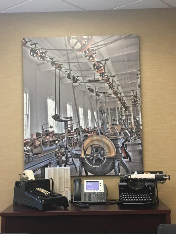 Old-fashioned accounting tools displayed in several of their conference rooms aren’t something you see every day