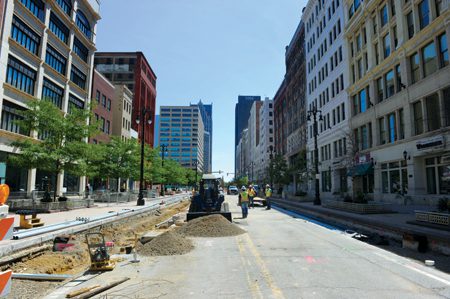 Workers deftly coordinated construction along Woodward Avenue as part of the placement of the M-1 Rail project, now called QLINE.