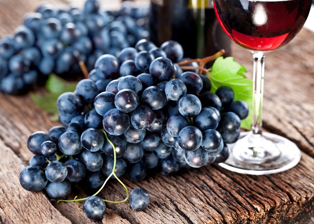 Grapes on a old wooden table.